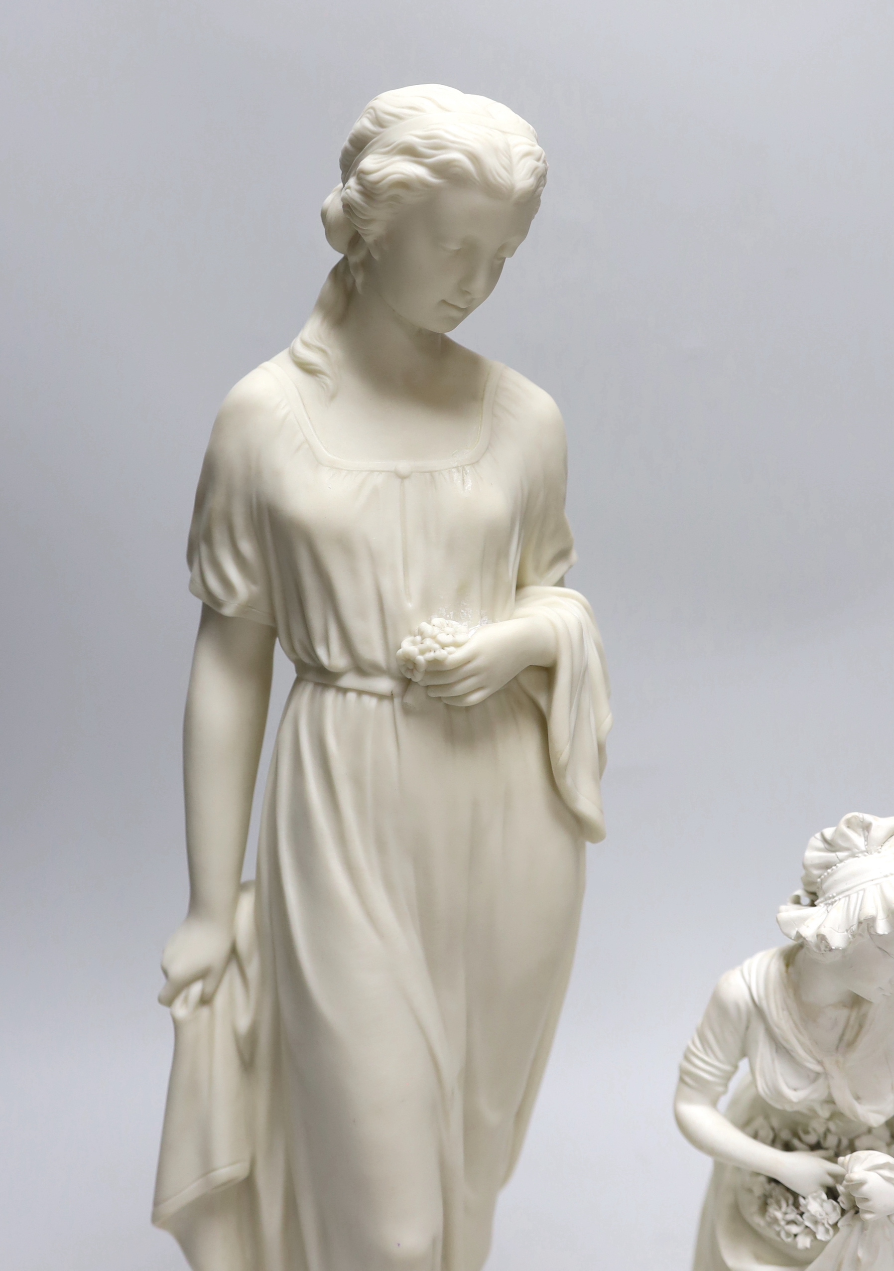 A Derby biscuit figure of a female gardener, c.1780, and a Copeland Parian female figure, the largest 43cm high